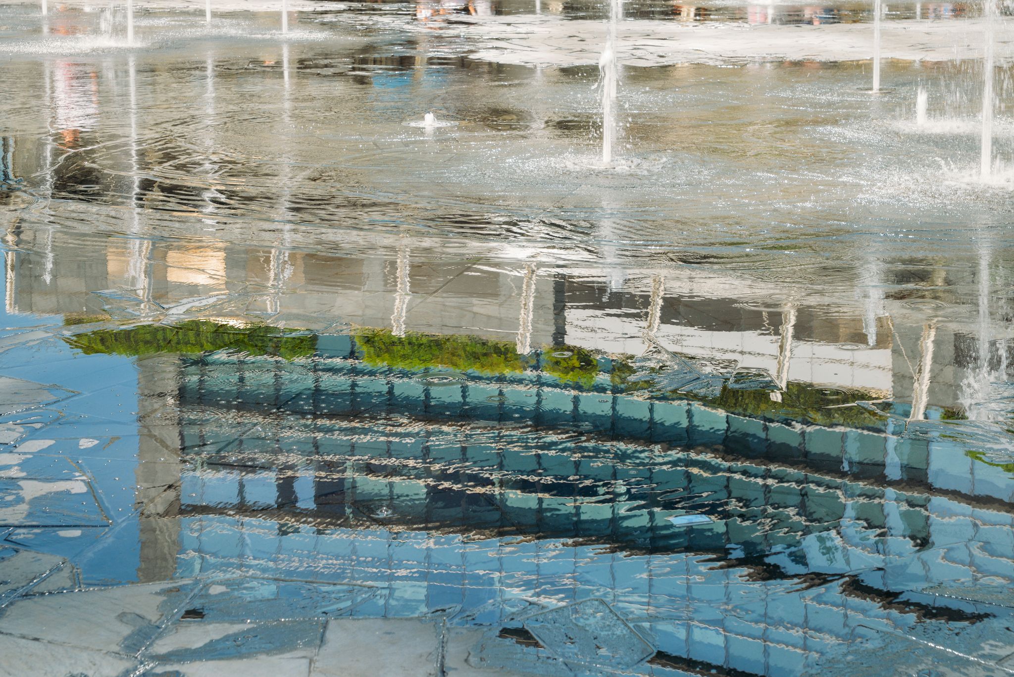PHOTO OF Reflection from fountain water in Gae Aulenti square, Milan, Lombardy, Italy.