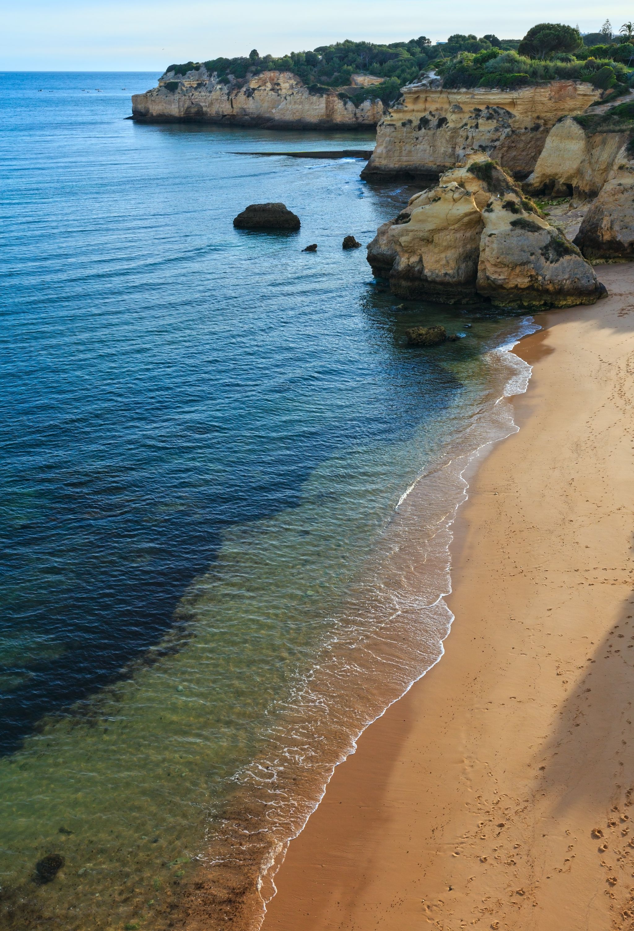 Beach Praia dos Beijinhos summer evening view. Atlantic coast landscape (Lagoa, Algarve, Portugal).
