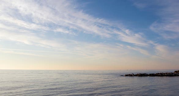 Photo of beautiful pacific sunset on the beach of Katerini in Greece.