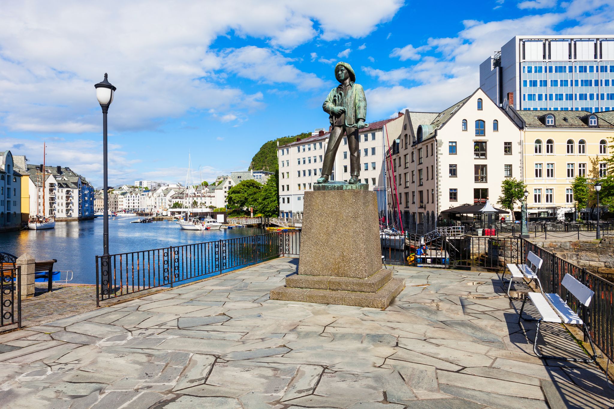 Skarungen fisher boy statue in Alesund, Norway. Monument dedicated to the fishing industry.