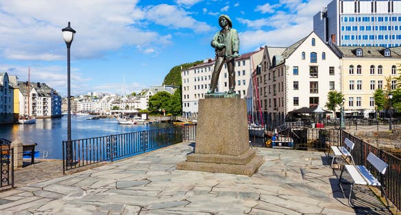 Skarungen fisher boy statue in Alesund, Norway. Monument dedicated to the fishing industry.