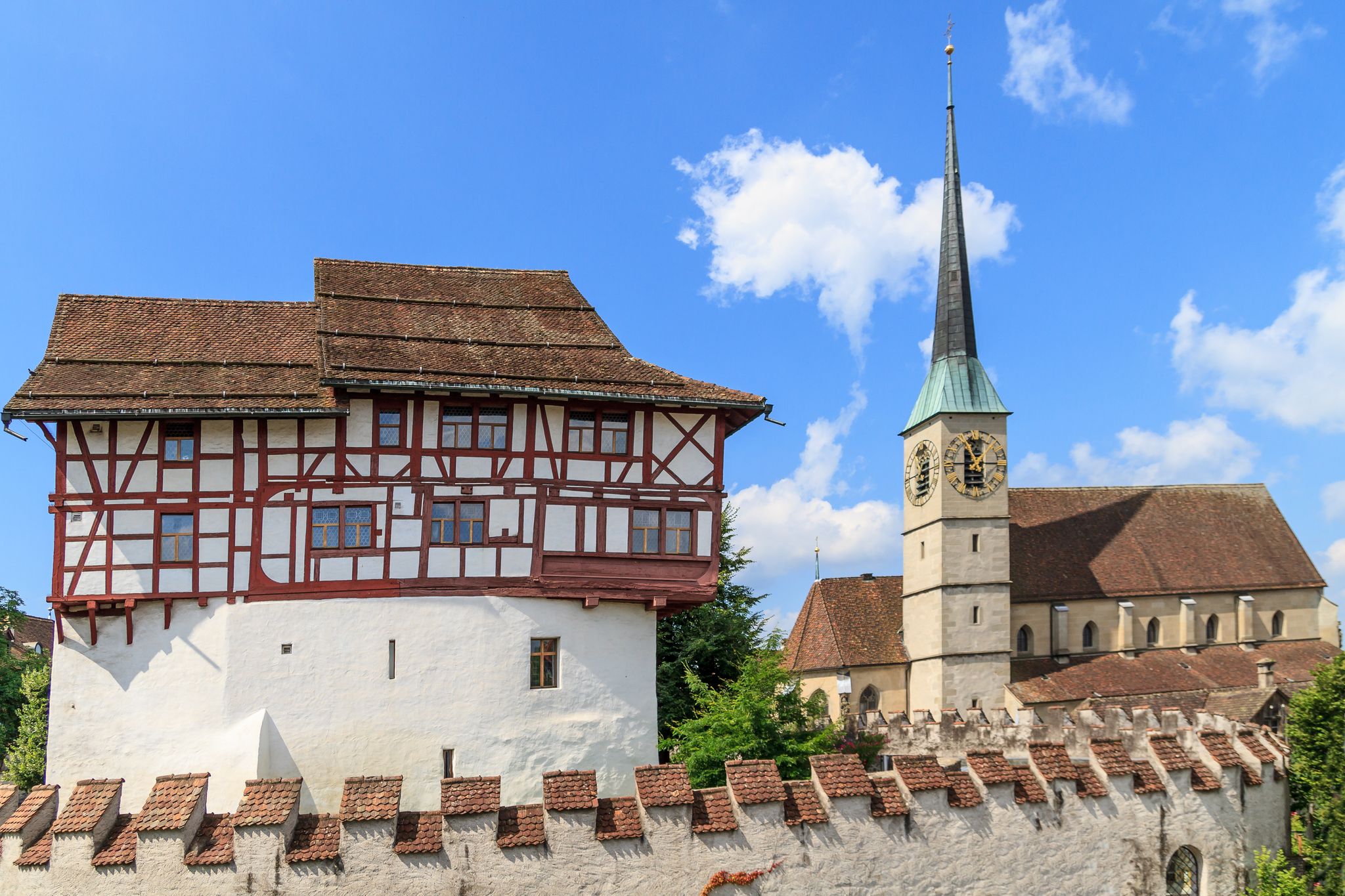 photo of Zug Castle and St. Oswald Church in the city of Zug, Switzerland.