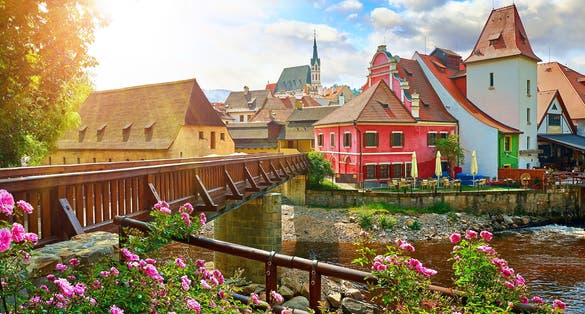 Photo of Wooden bridge over river Vltava, Český Krumlov, Czech Republic.