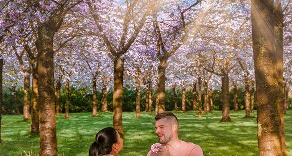 photo of young couple picnic in Bloesempark in Amstelveen in Amsterdamse Bos, the Netherlands.