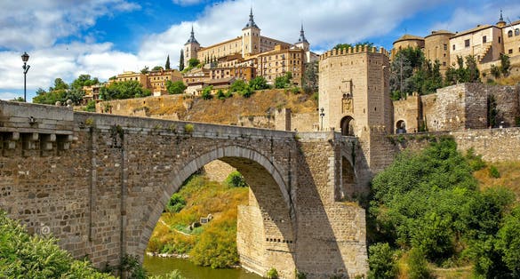 photo of view of Cityscape of Toledo with the Alcantara bridge in the forefront, Toledo, Spain