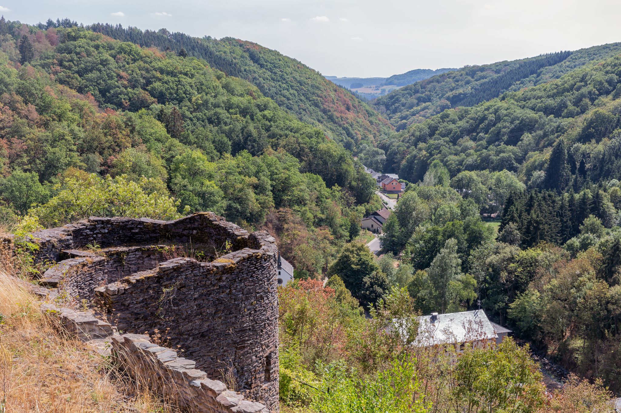 Medieval ruin of Brandenbourg castle at hill in Luxembourg Ardennes 70 meter above village of Brandenbourg