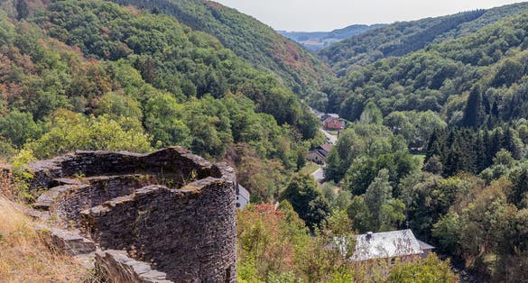 Medieval ruin of Brandenbourg castle at hill in Luxembourg Ardennes 70 meter above village of Brandenbourg