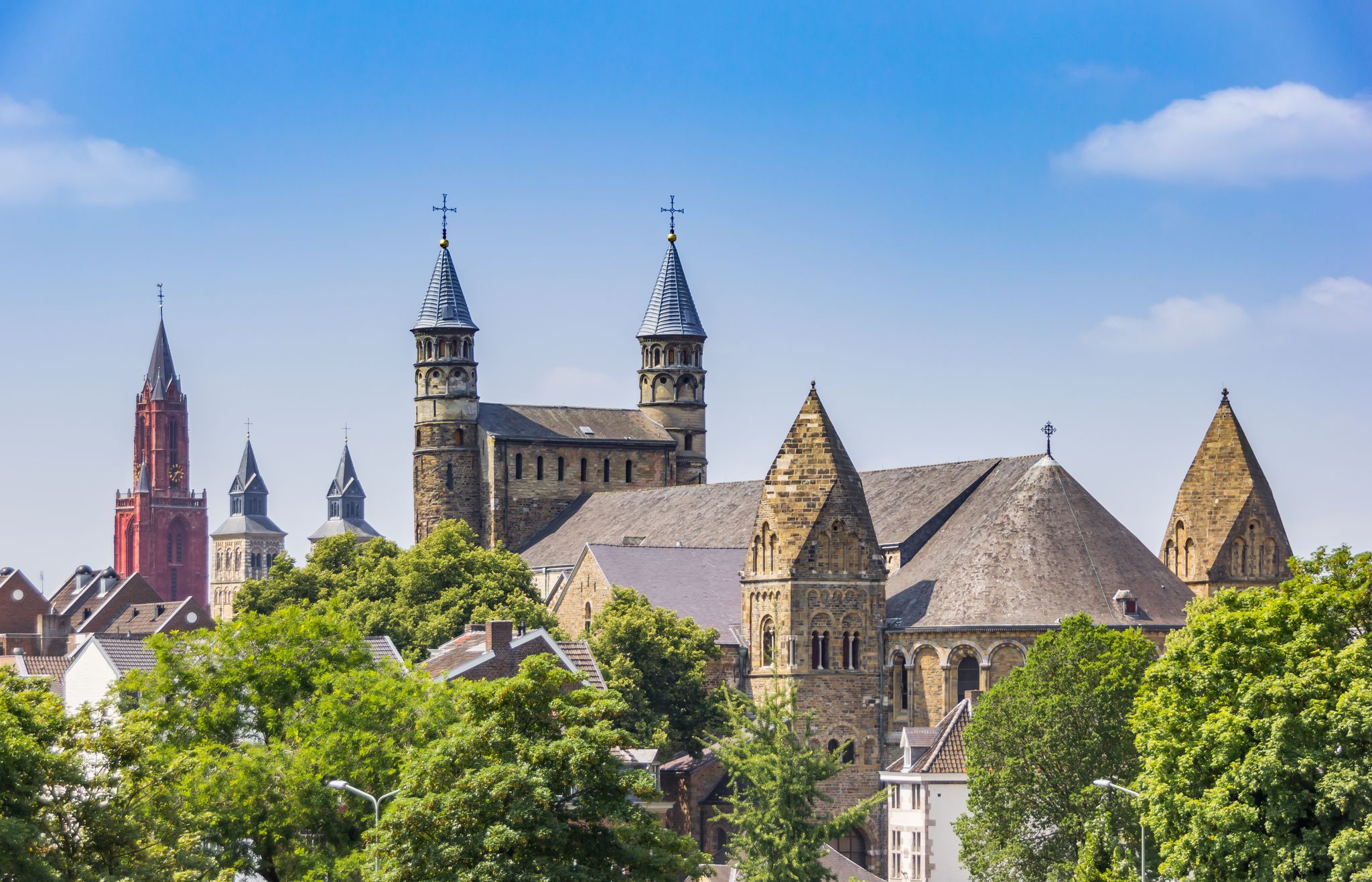 photo of Basilica of Our Lady towers in the skyline of Maastricht, the Netherlands.