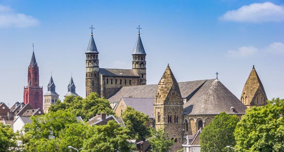 photo of Basilica of Our Lady towers in the skyline of Maastricht, the Netherlands.