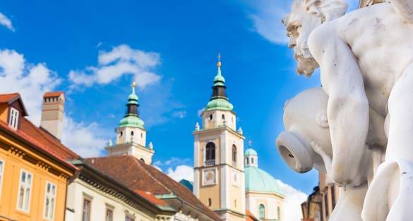 Photo of Robba fountain in Ljubljana, Cathedral and town square street on early summer morning.