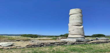 Photo of aerial view of Pythagorio port with colourful houses and blue sea, Samos island, Greece.