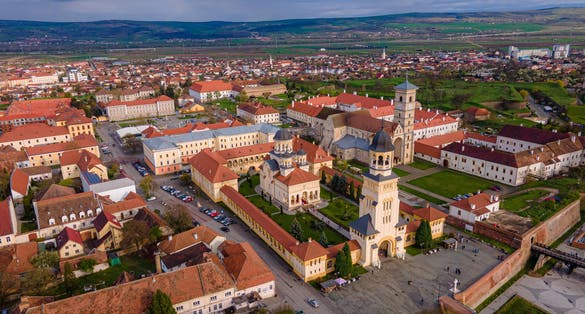 photo of view of Aerial view of the Alba Carolina citadel located in Alba Iulia, Romania. In the photography can be seen the Reunification Cathedral from above, shot from a drone with camera level for a panoramic view