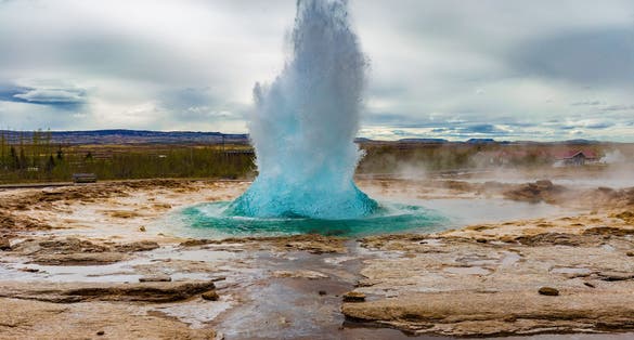 photo of the great geysir erupting in spring, Iceland.