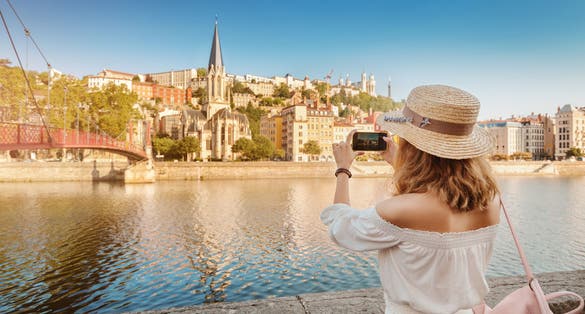 Photo of tourist walks through the center of Lyon's old town, France.