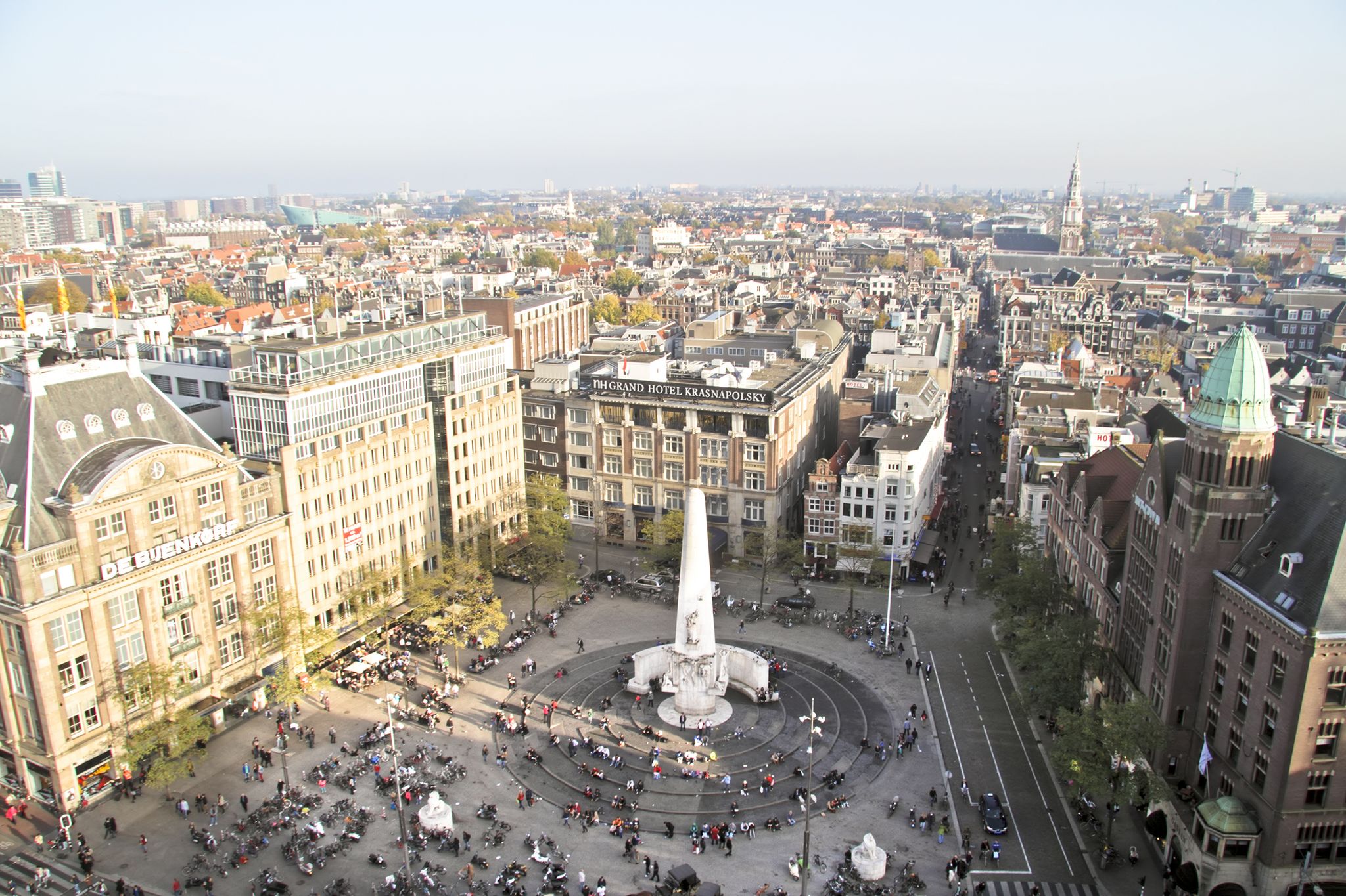 photo of aerial view of Dam square with National Monument in Amsterdam, the Netherlands.