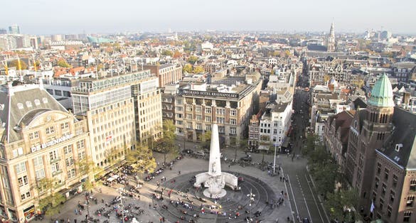 photo of aerial view of Dam square with National Monument in Amsterdam, the Netherlands.