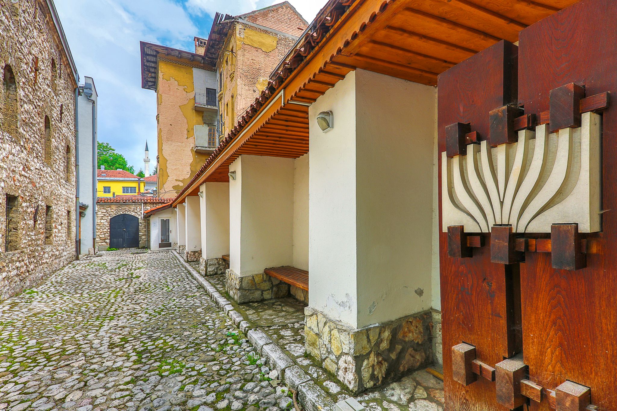 photo of view of Synagogue in Sarajevo known as the oldest one, built in 1581, with a minaret in the background, Bosnia and Herzegovina,Bosnia & Herzegovina Bosnia & Herzegovina.