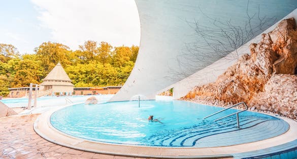 photo of view of Miskolc, Hungary - 3. june. 2022: Tourists enjoy at the cave with thermal water - natural SPA in Hungary at Miskolc Hungary