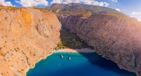 Photo of aerial view of amazing beach Butterfly Valley in Oludeniz Fethiye Turkey.