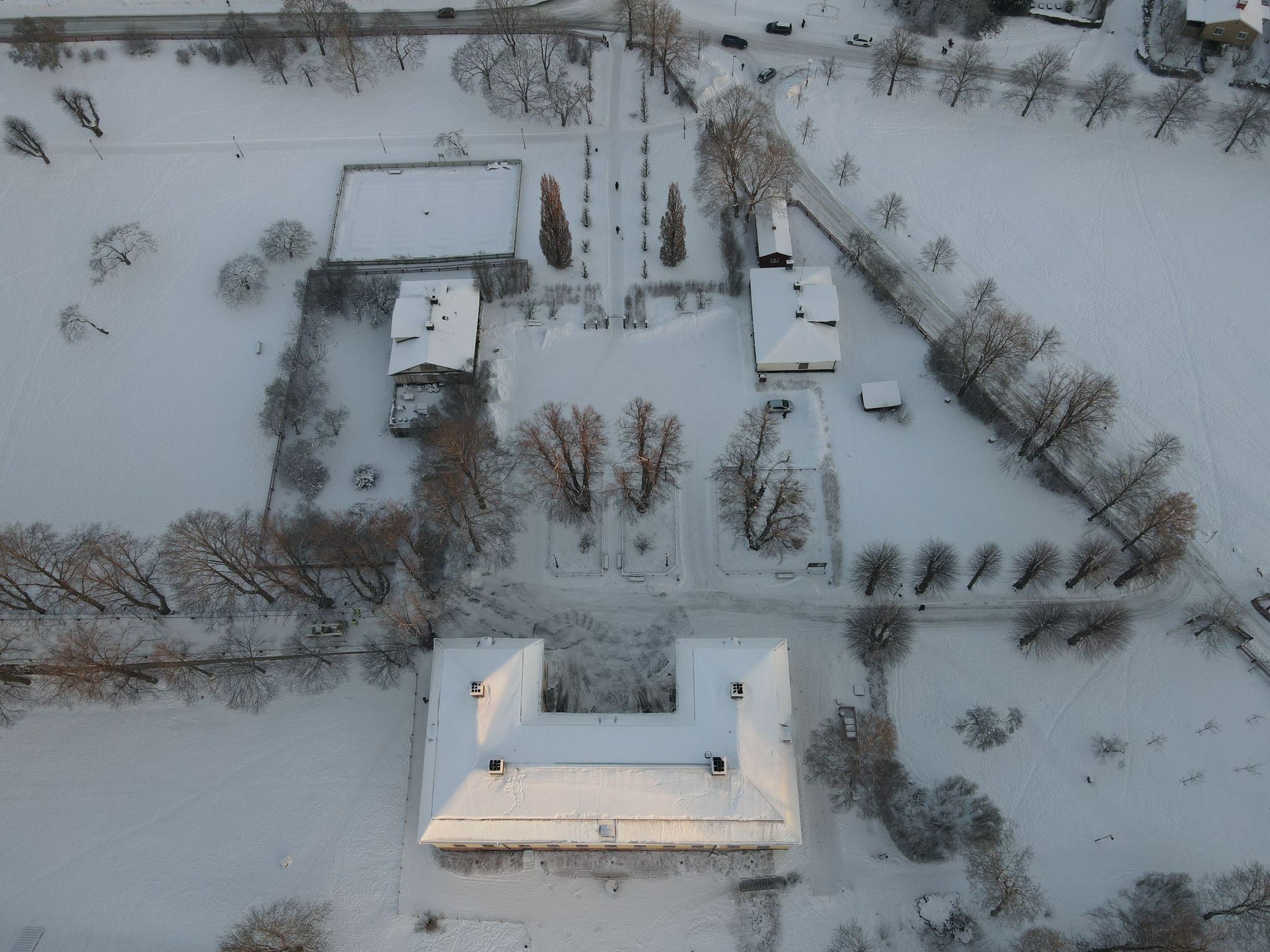 photo of an aerial shot of a snow-covered Ulriksdal Palace in Stockholm, Sweden on a beautiful winter morning.