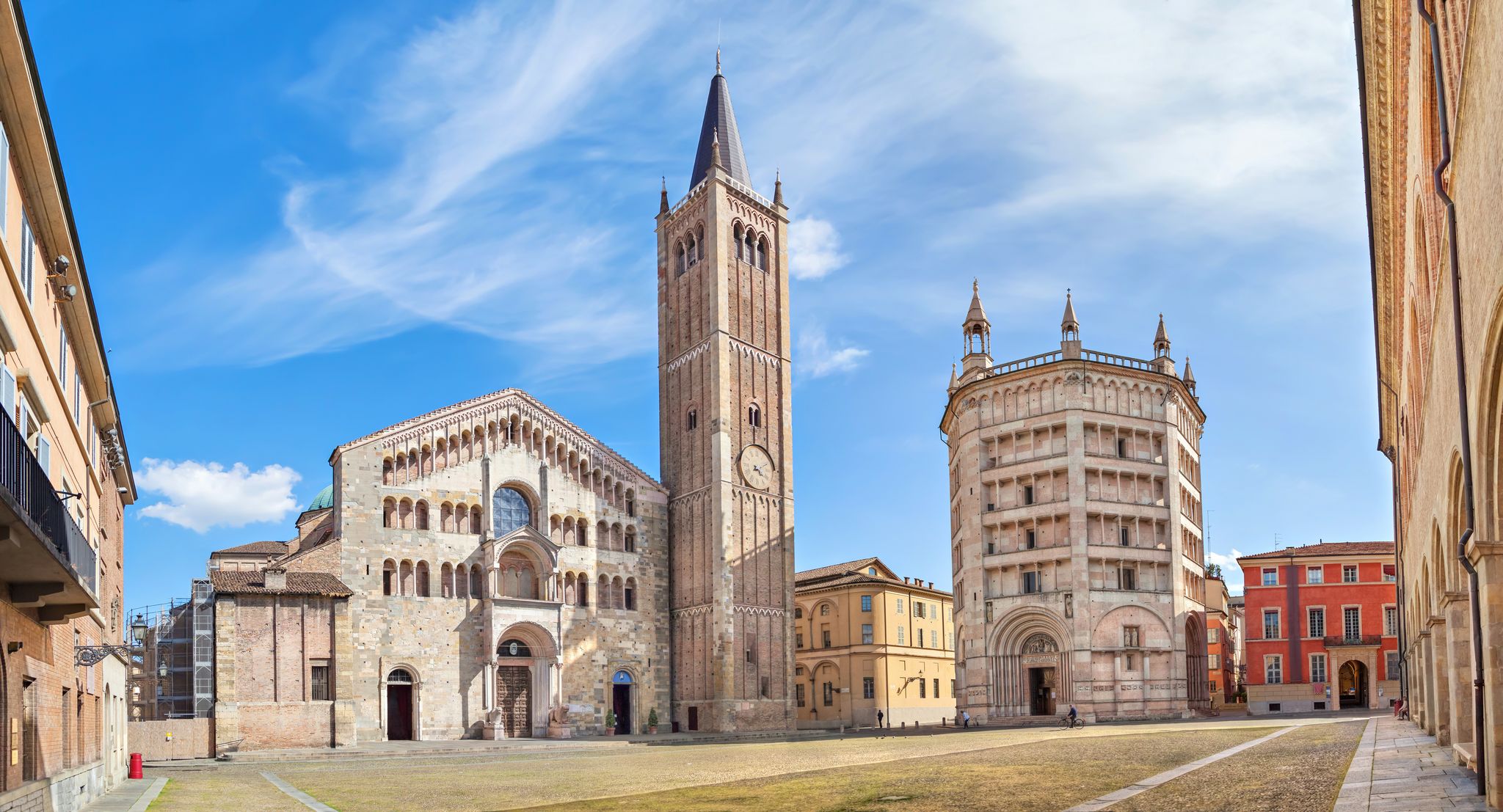 Photo of panorama of Parma cathedral with Baptistery leaning tower on the central square in Parma town in Italy.