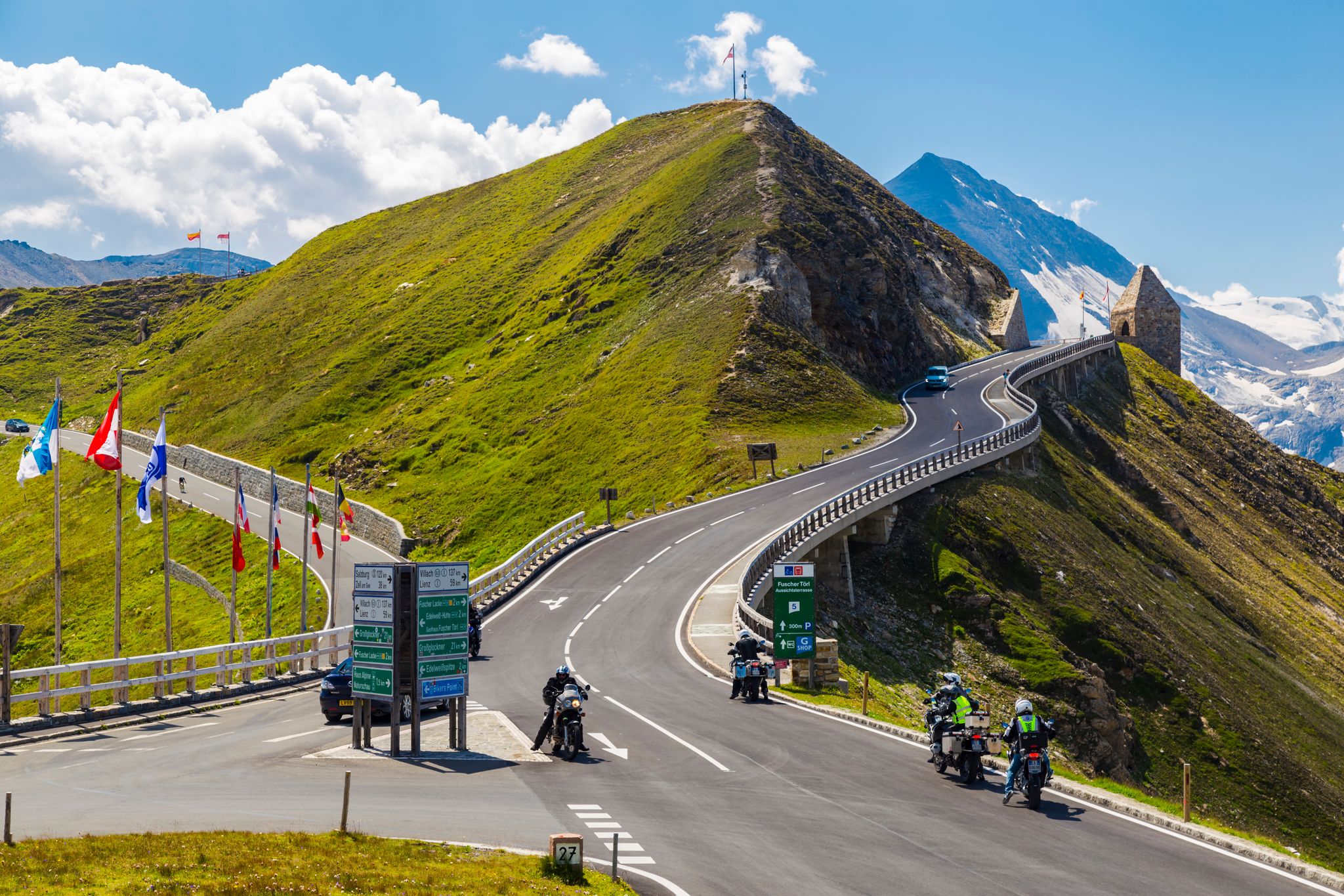 photo of  view of 04.08.2018 . Grossglockner High Alpine Road . Austria. Tyrol. Europe. People on cars and motorcycles travel on mountain serpentine. Tourist destination, tourist attraction. Concept of autotourism.,Rauris Austria.
