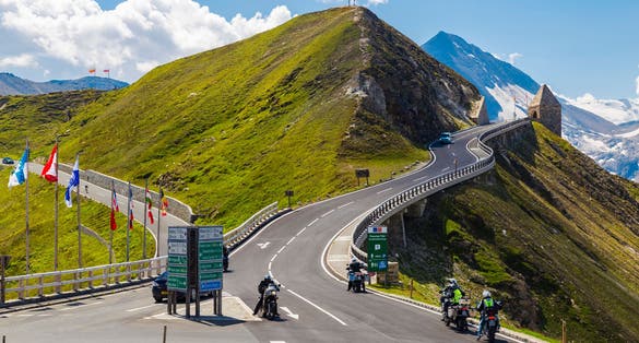 photo of  view of 04.08.2018 . Grossglockner High Alpine Road . Austria. Tyrol. Europe. People on cars and motorcycles travel on mountain serpentine. Tourist destination, tourist attraction. Concept of autotourism.,Rauris Austria.