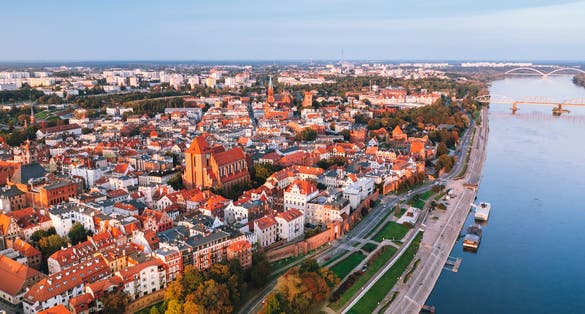 Photo of aerial view of Torun old town with Vistula river, Poland.