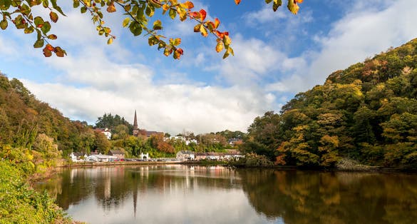 photo of view of Glanmire Village Cork Ireland beautiful view autumn orange leaves river reflection