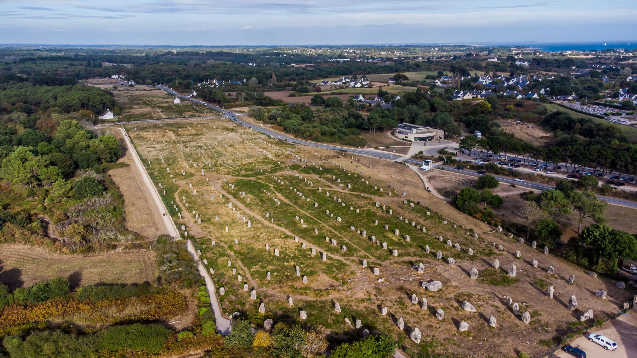 photo of aerial view of the Carnac stone alignments of Ménec in Morbihan, France.