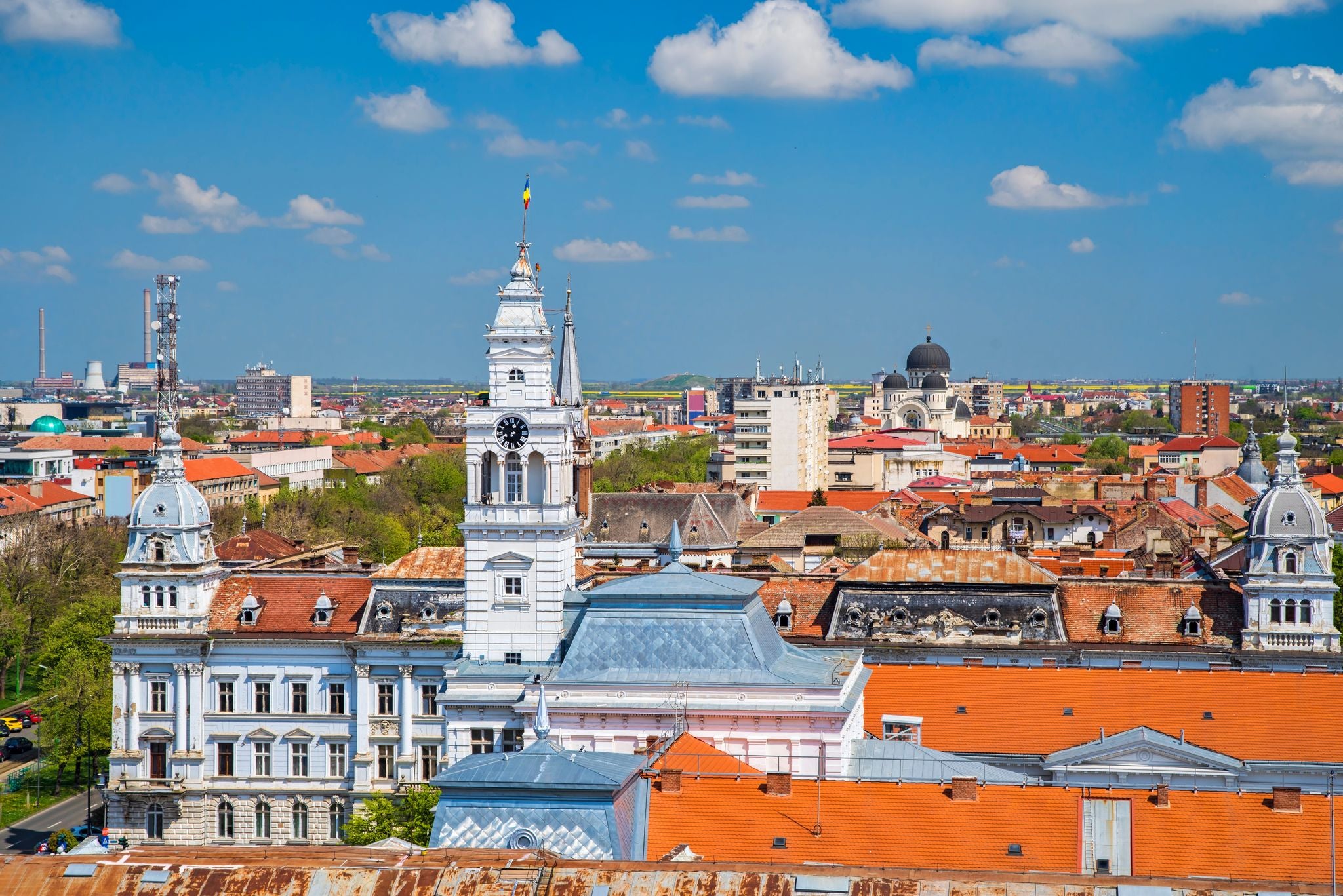 photo of view of Arad City Hall and aerial view of the city during summer. Arad City Hall in Romania is situated in the city center, and it serves as the administrative headquarters for local government activities.