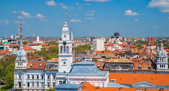photo of view of Arad City Hall and aerial view of the city during summer. Arad City Hall in Romania is situated in the city center, and it serves as the administrative headquarters for local government activities.