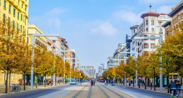 Photo of people are strolling through Paseo de la Independencia in Zaragoza, Spain.