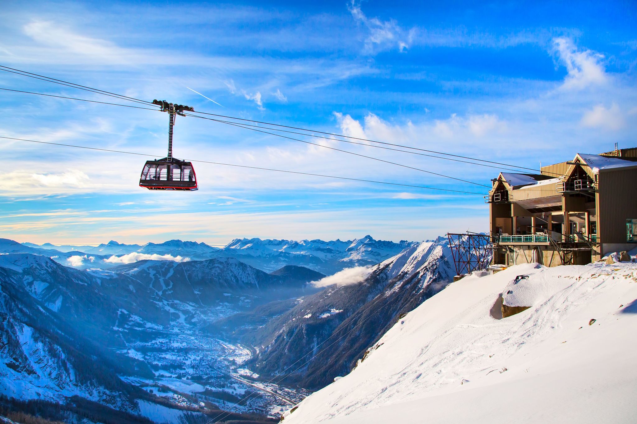 Photo of The winter view on the montains and ski lift station in French Alps near Chamonix Mont-Blanc.
