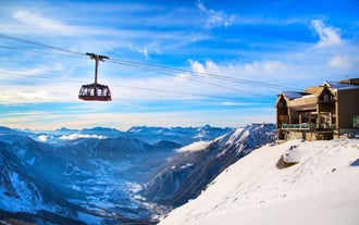 Photo of The winter view on the montains and ski lift station in French Alps near Chamonix Mont-Blanc.