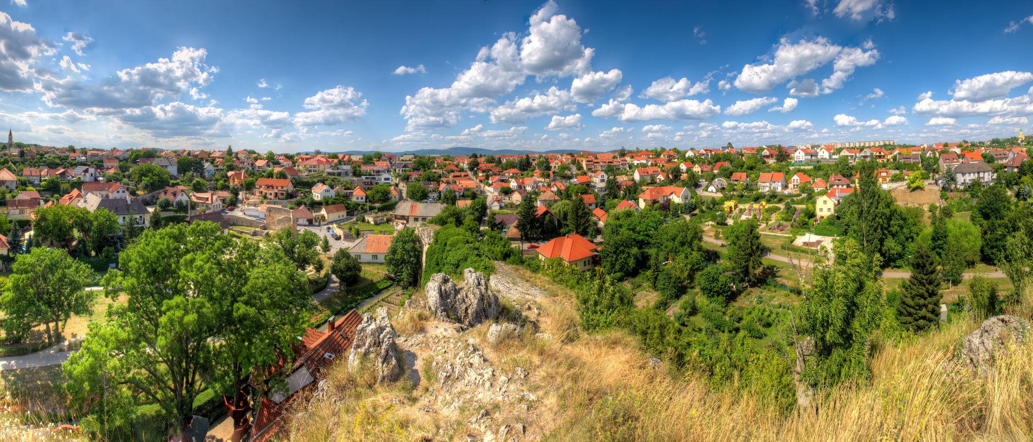 Elevated panoramic view over the outskirts of the Hungarian city of Veszprém near Lake Balaton with terraced houses and detached houses in an upscale residential style
