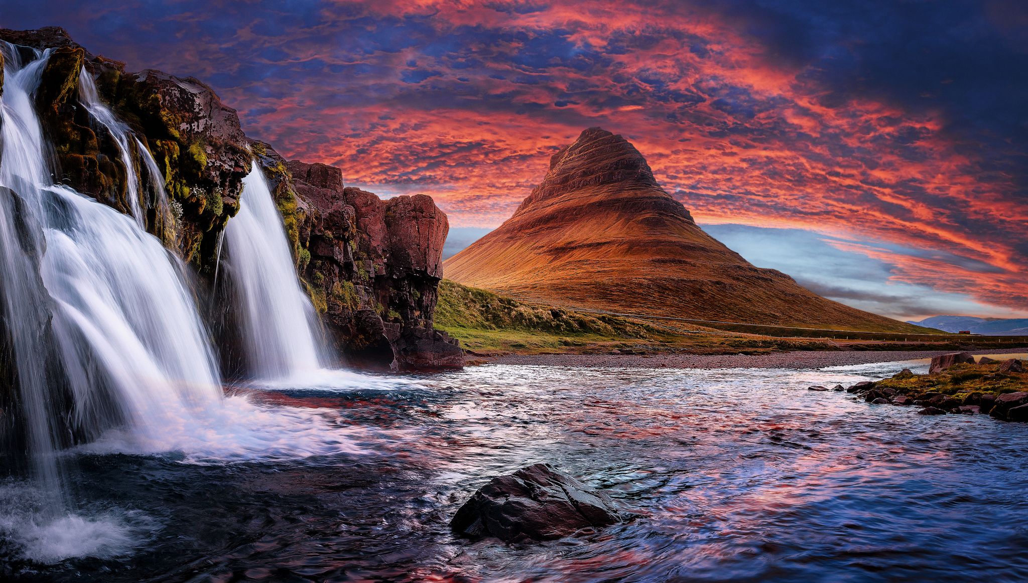 photo of incredible nature landscape of Iceland. Fantastic picturesque sunset over majestic Kirkjufell (Church mountain) and waterfalls. Kirkjufell mountain, Iceland. Famous travel locations.