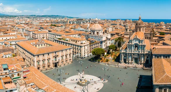 Aerial view on via Etnea in Catania. Dome of Catania and the main street with the background of volcano Etna, Sicily, Italy. Catania the UNESCO World Heritage.