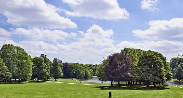 Photo of the Bois de la Cambre park in Brussels with its lake on a bright summers day, Belgium.