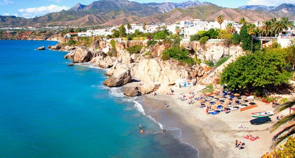 Photo of tourist spaces in the town of Nerja, Málaga, one of the white villages of Andalusia, Spain, Calahonda beautiful beach.