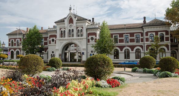 photo of view of  scenic view of Hamar station building and flowers, Hedmark, Norway.