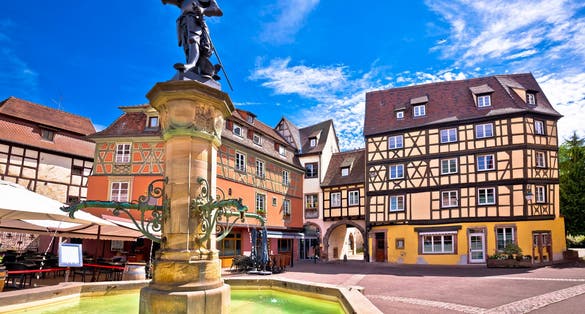 Photo of Colorful historic town of Colmar square and fountain view, Alsace region of France.