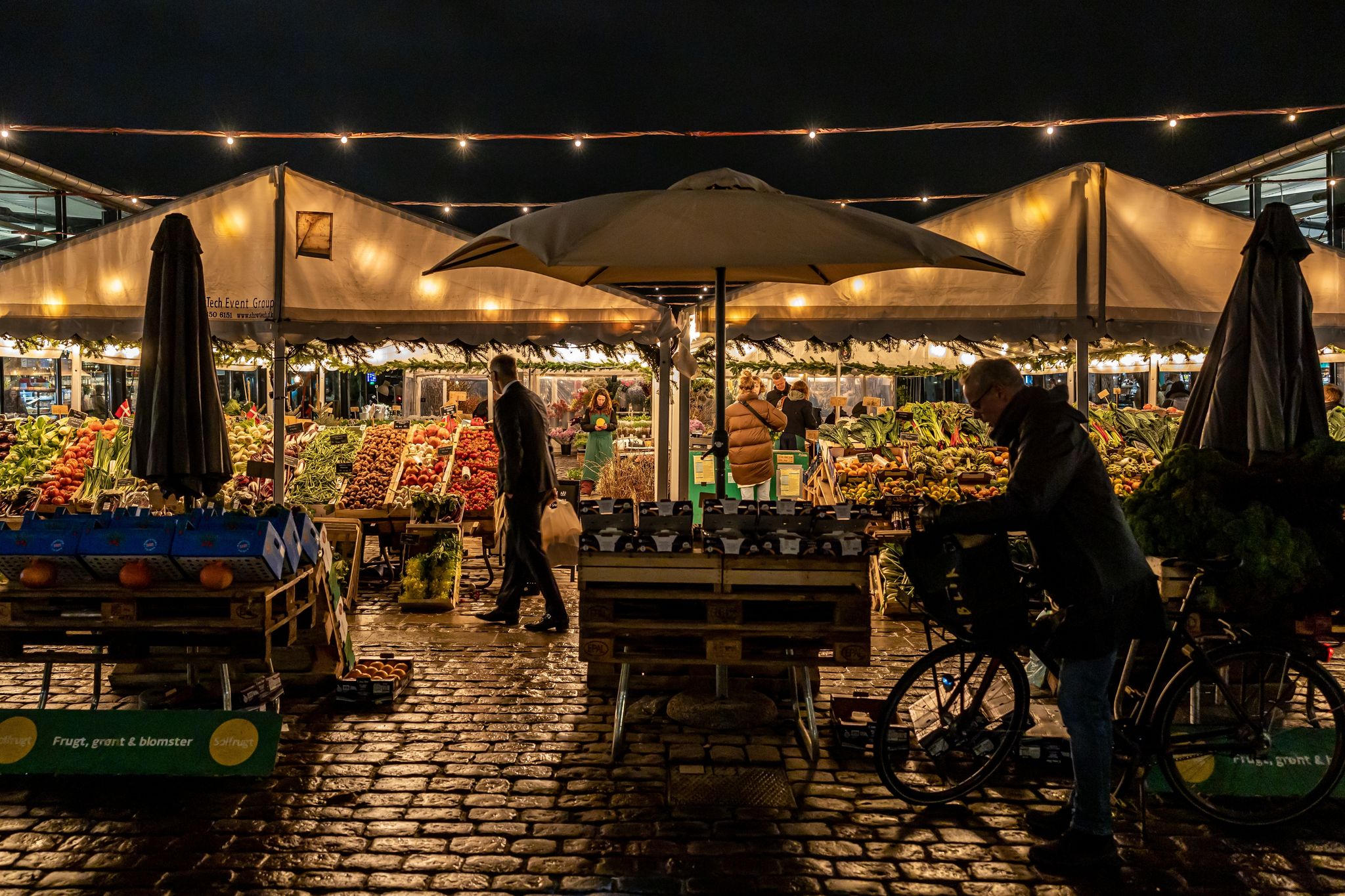 Photo of Torvehallerne outdoor food market at night.