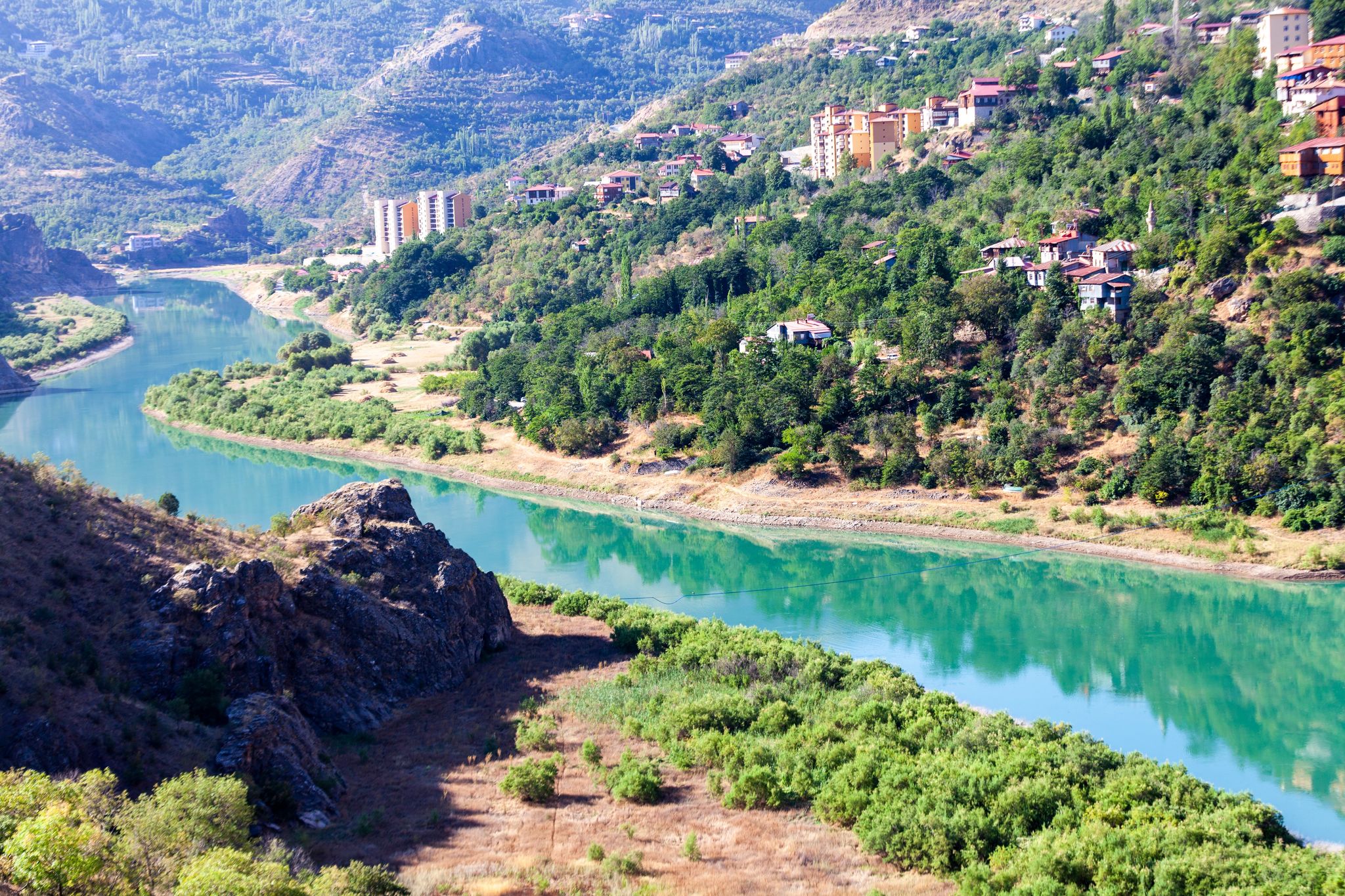 Photo of traditional Erzincan Kemaliye houses, the Dark Canyon and Euphrates River, during the summer season. 