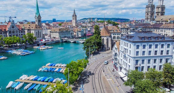 Photo of Aerophotography.View from a flying drone.Panoramic view of the historical center of Zurich with the famous Fraumunster and Grossmünster churches.