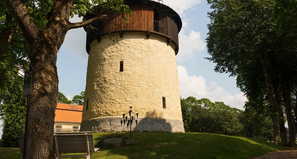 photo of view of Protestant church, bell tower and cemetery in Lerbo, Södermanland, Sweden.