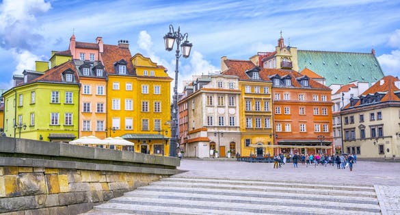 Photo of colorful houses in Castle Square in the old town of Warsaw, Poland.