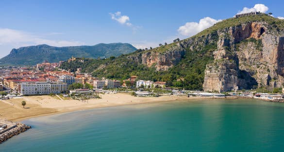 A view from the Terracina pier to the mountain Pisco Montano with the famous ancient ruins of Jupiter Anxur temple or Tempio di Giove Anxur at the top. Province of Latina, Lazio region, Italy.
