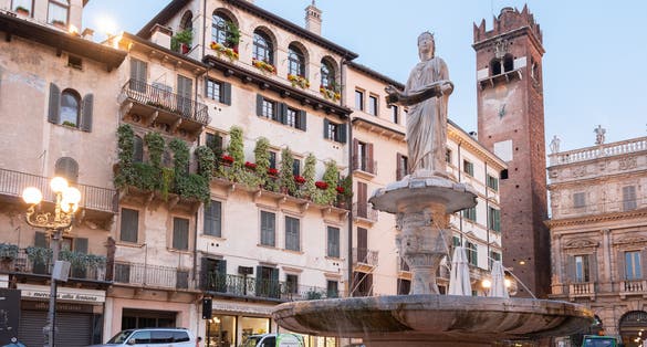PHOTO OF The western side of the Piazza delle Erbe (Market's square) with the Baroque Palazzo Maffei, a marble column with St. Mark's Lion, symbol of the Republic of Venice.