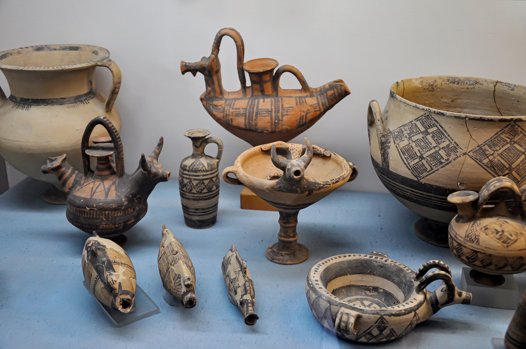 Photo of Archaeological finds and pottery, Ceramics and plates. Vases in Cyprus Museum.